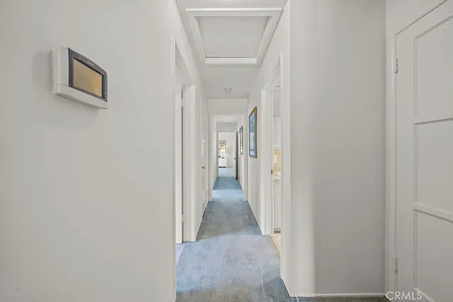 a view of a hallway with a white walls