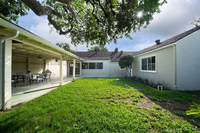 a view of a house with a yard porch and sitting area