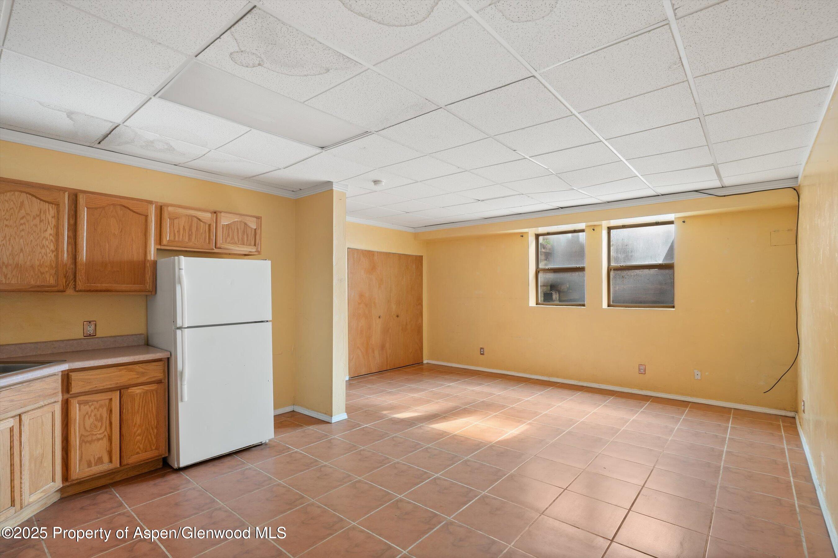 111 Ridge Trail Aspen, CO 81611 - Photo 20 of 37 a view of an empty room with a kitchen