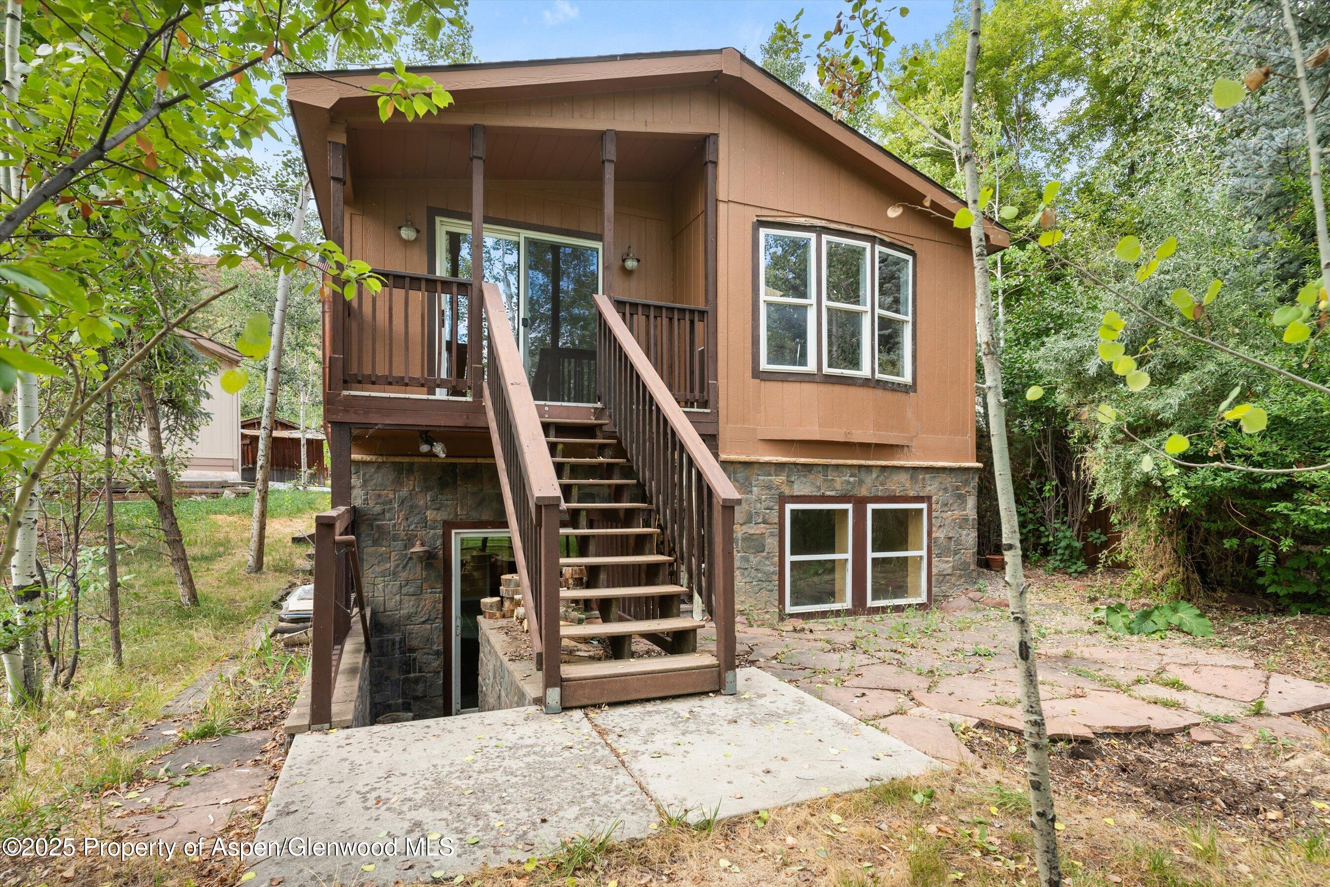 111 Ridge Trail Aspen, CO 81611 - Photo 3 of 37 a view of a house with backyard and windows