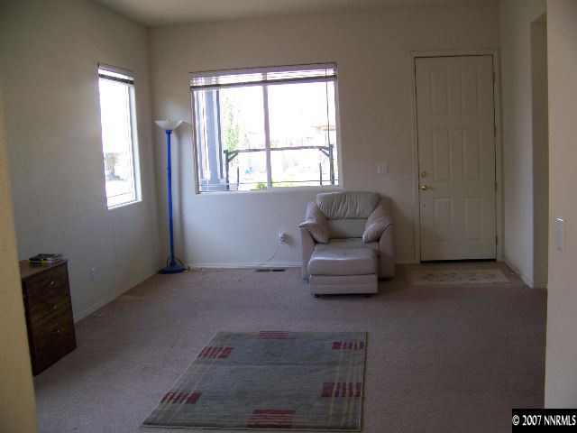 9631 Comanche Moon Drive Reno, NV 89521 - Photo 4 of 9 a living room with furniture and a window