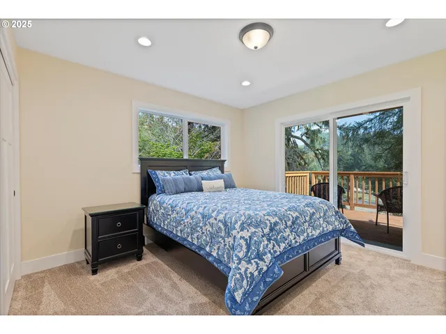 a bedroom with a bed and a view of bathroom