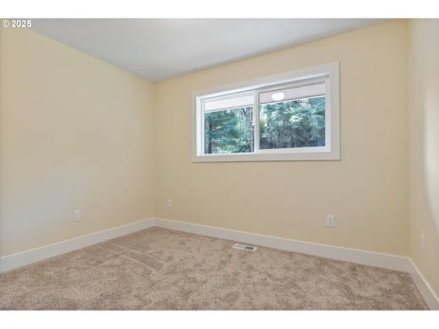 a view of balcony with wooden floor