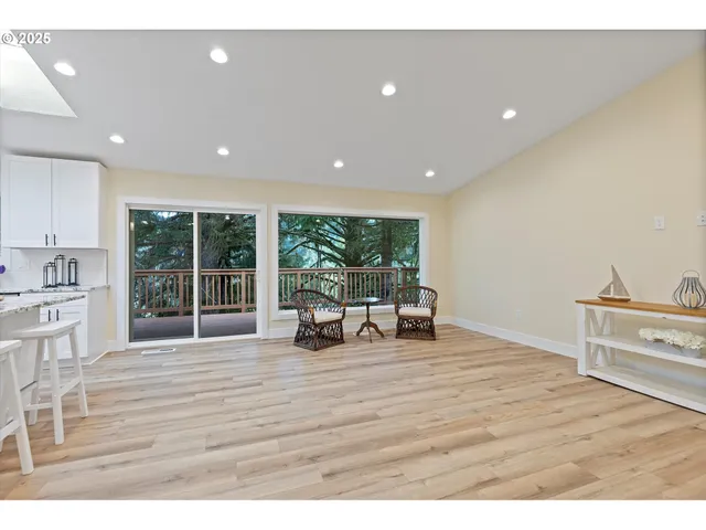 a view of kitchen with furniture and large window