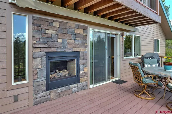 a view of a balcony with wooden floor