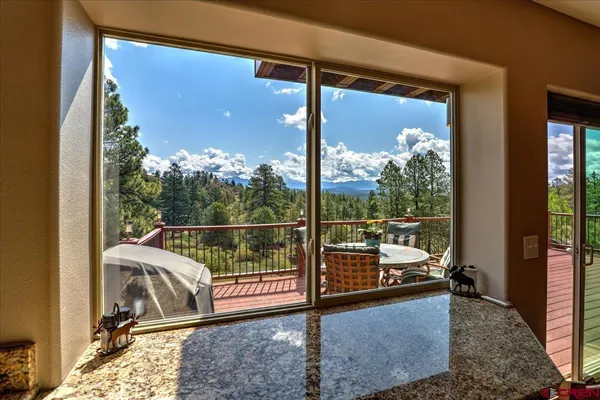 a kitchen with stainless steel appliances granite countertop a stove sink and microwave