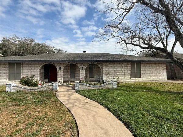 a front view of a house with yard