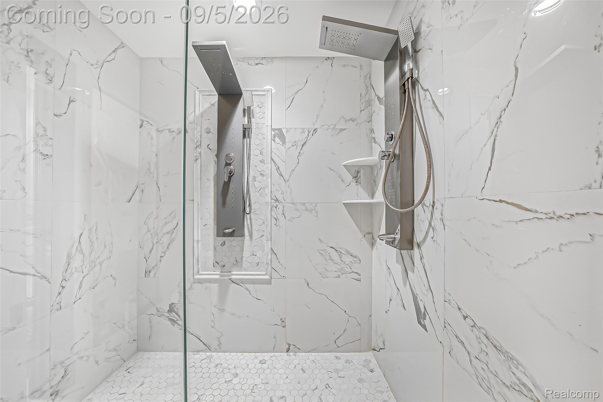 2785 Cranbrook Ridge Court Rochester, MI 48306 - Photo 43 of 97 Walk-in shower with full height white marble-look tiling, dual shower systems, and mosaic tile flooring