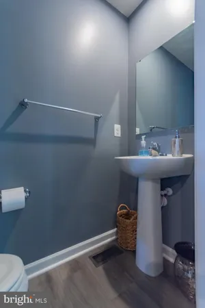 a kitchen with a sink a counter top space and stainless steel appliances