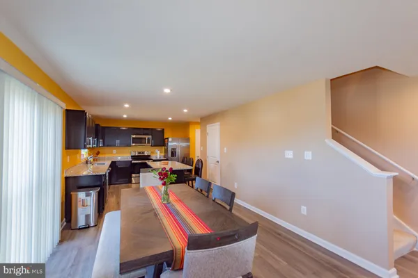 a kitchen with a sink and wooden cabinets