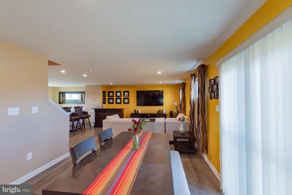 a bedroom with furniture and a flat screen tv
