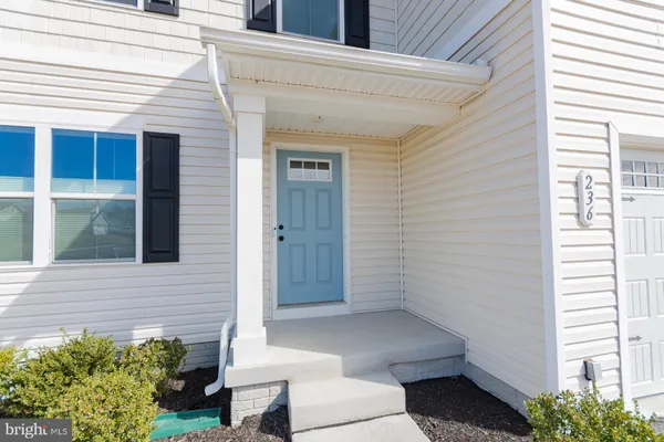 a living room with furniture or couch and a wooden floor