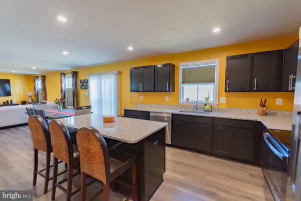 a bedroom with a bed and a chair