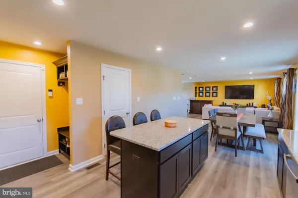 a view of walk in closet with clothes