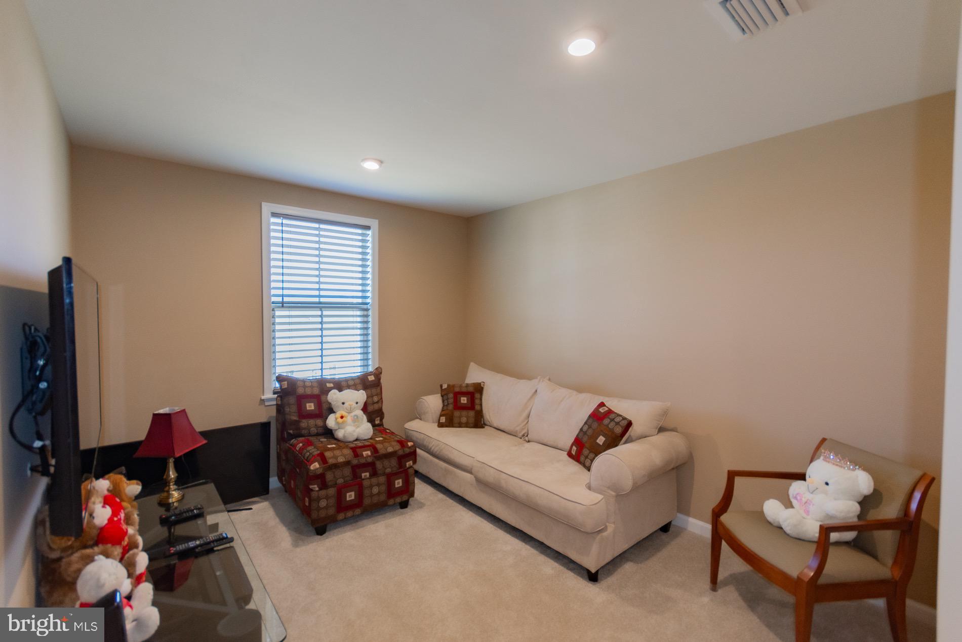 236 Surplus Road Inwood, WV 25428 - Photo 24 of 72 a living room with furniture and a window