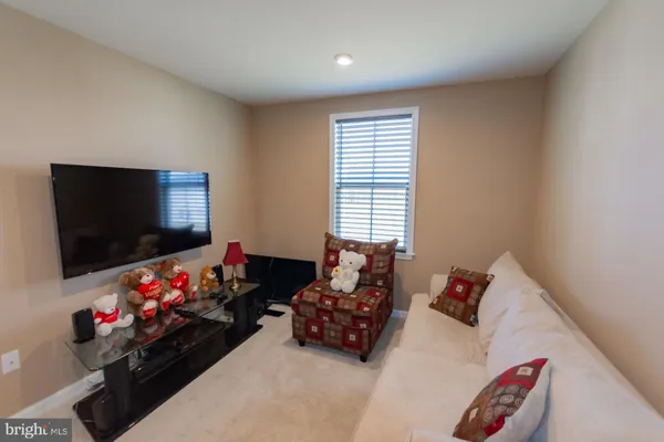 a bedroom with a bed and a chair