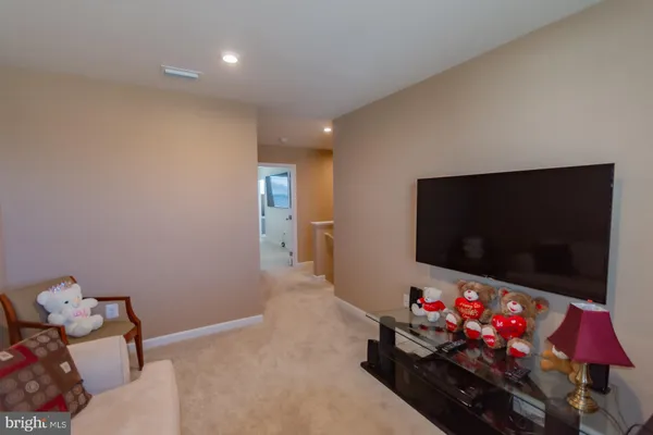 a bedroom with a bed and dresser