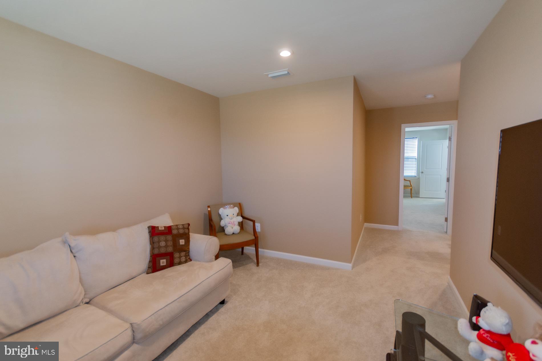 236 Surplus Road Inwood, WV 25428 - Photo 27 of 72 a living room with furniture and a flat screen tv