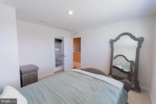 a view of a room with table and chairs