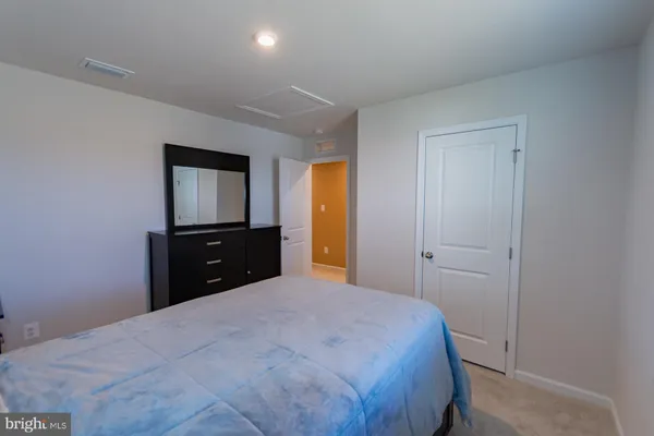 a room with gym equipment and a table