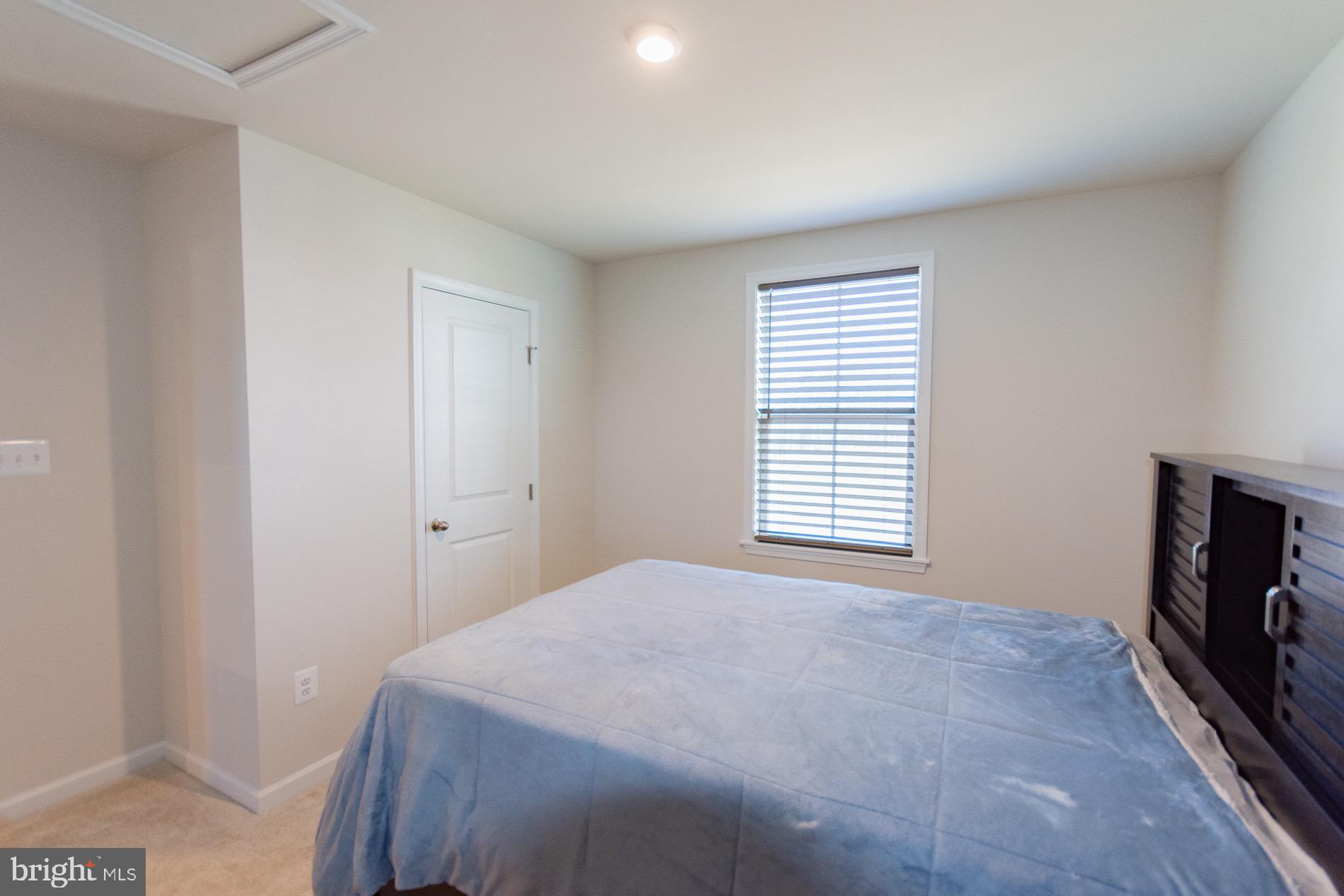 236 Surplus Road Inwood, WV 25428 - Photo 45 of 72 a bedroom with a bed and a tv