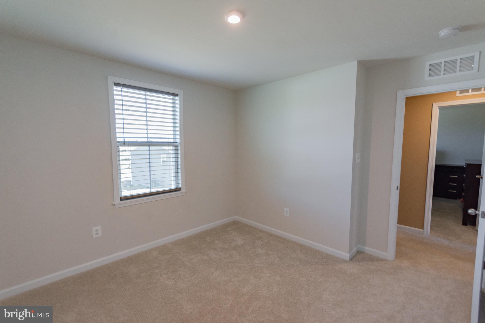 236 Surplus Road Inwood, WV 25428 - Photo 48 of 72 an empty room with windows and closet