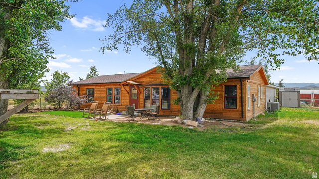490 South Main Street Kamas, UT 84036 - Photo 2 of 25 Exterior wood-sided residence with multiple windows and a shingled roof