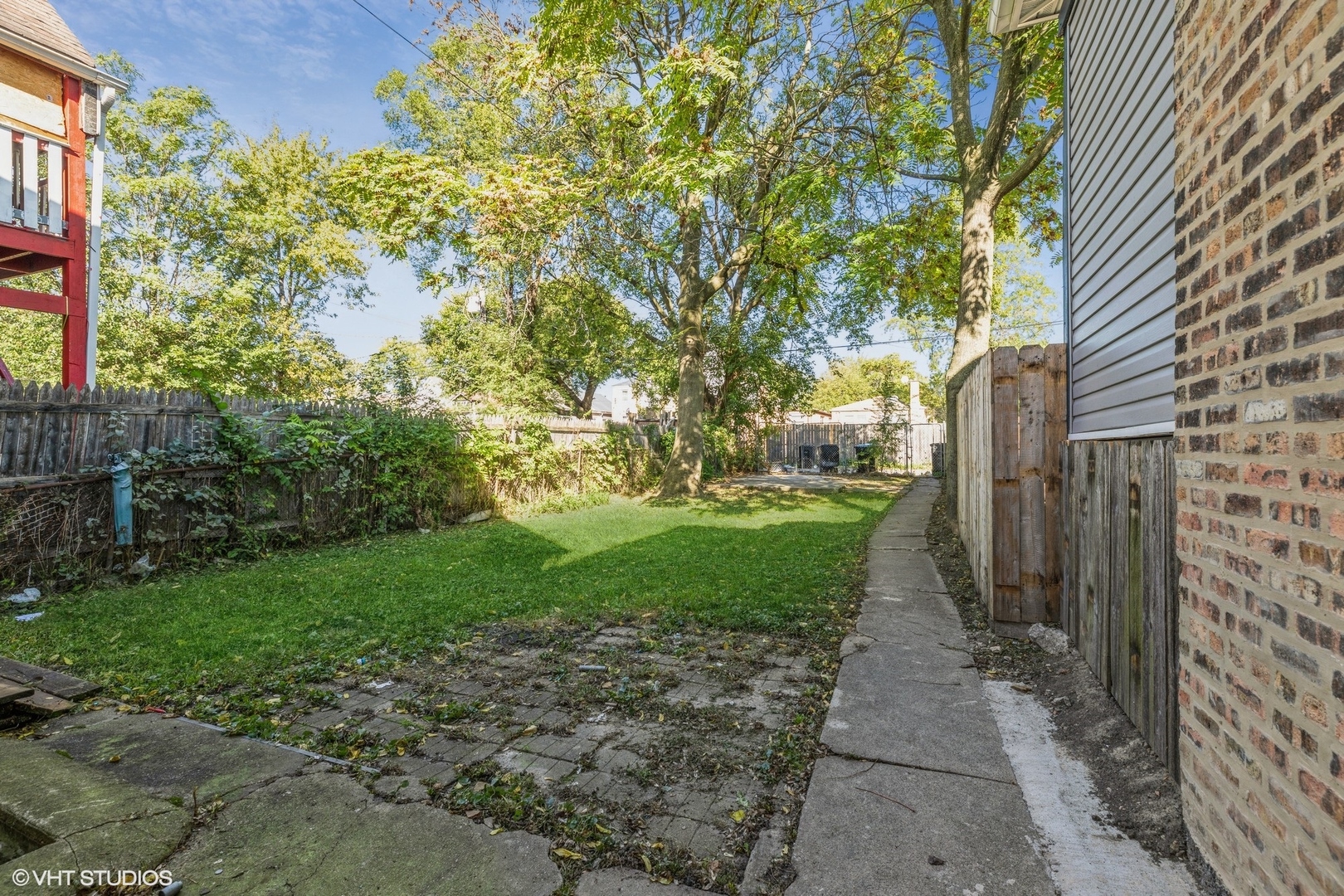 2022 West 68th Street Chicago, IL 60636 - Photo 9 of 10 a view of a pathway both side of house
