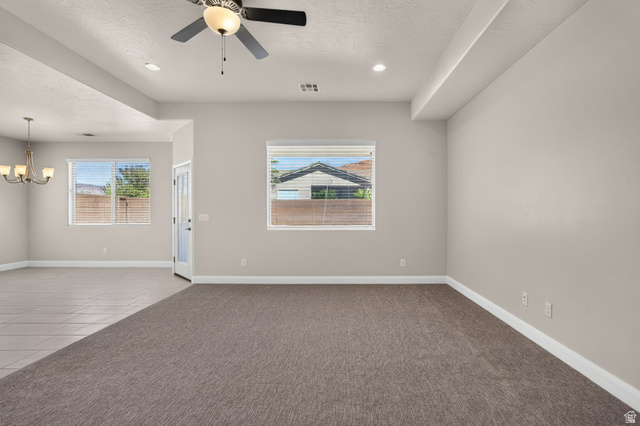 11 East 640 South Ivins, UT 84738 - Photo 10 of 44 Open-concept living space featuring recessed lighting, a ceiling fan with light fixture, and warm gray carpeting