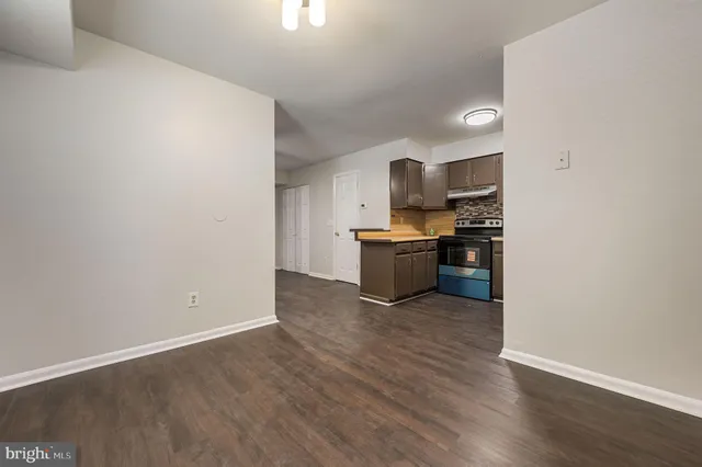 a view of kitchen with wooden floor