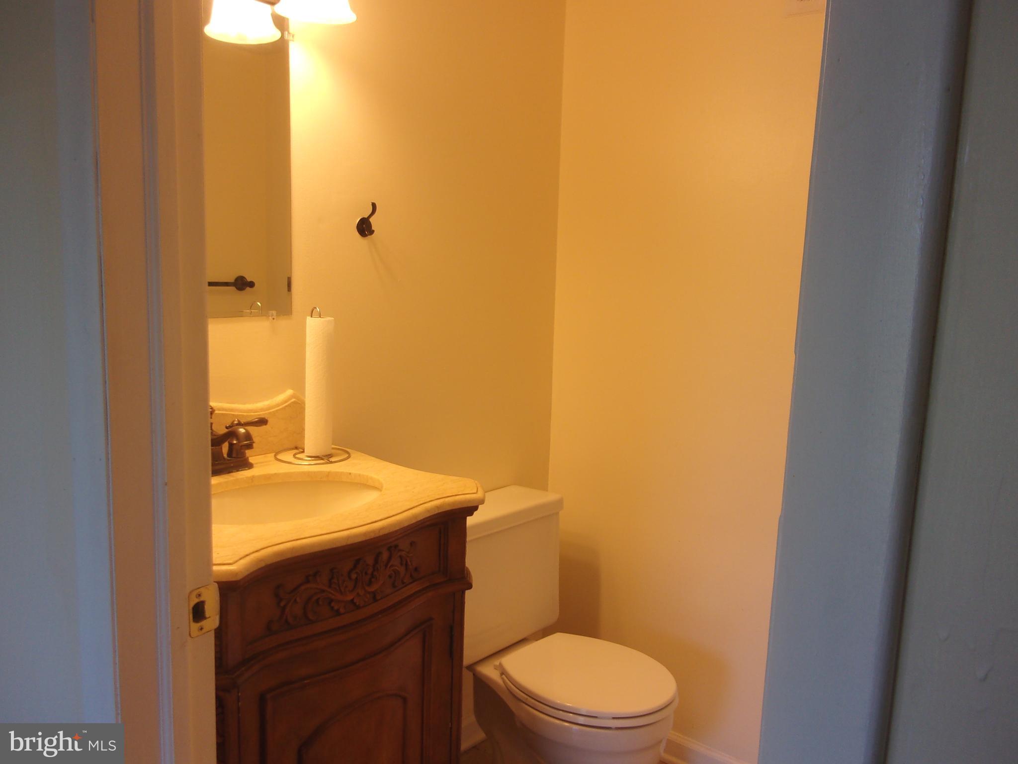 27 Chiswick Drive Lindenwold, NJ 08021 - Photo 6 of 12 a bathroom with a sink a toilet and mirror