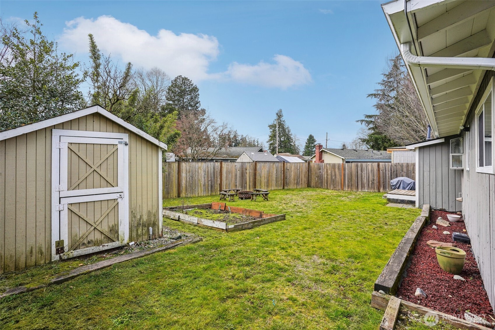 3709 Northeast 9th Court Renton, WA 98056 - Photo 19 of 21 a backyard of a house with table and chairs