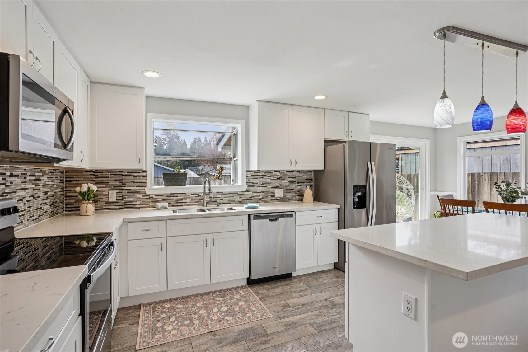 3709 Northeast 9th Court Renton, WA 98056 - Photo 2 of 21 a kitchen with a sink stove and refrigerator