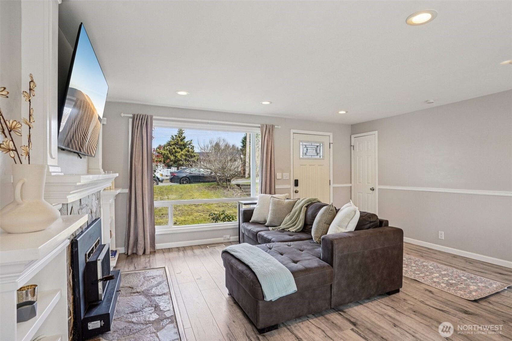 3709 Northeast 9th Court Renton, WA 98056 - Photo 6 of 21 a living room with furniture a large window with kitchen view