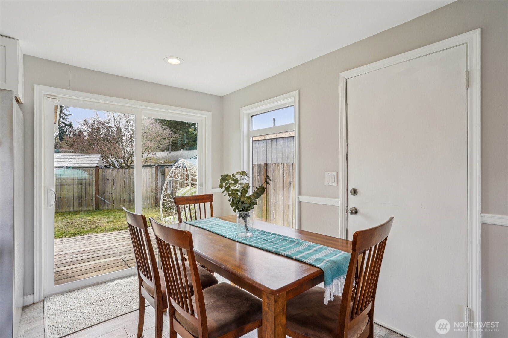 3709 Northeast 9th Court Renton, WA 98056 - Photo 9 of 21 a view of a dining room with furniture wooden floor and a potted plant