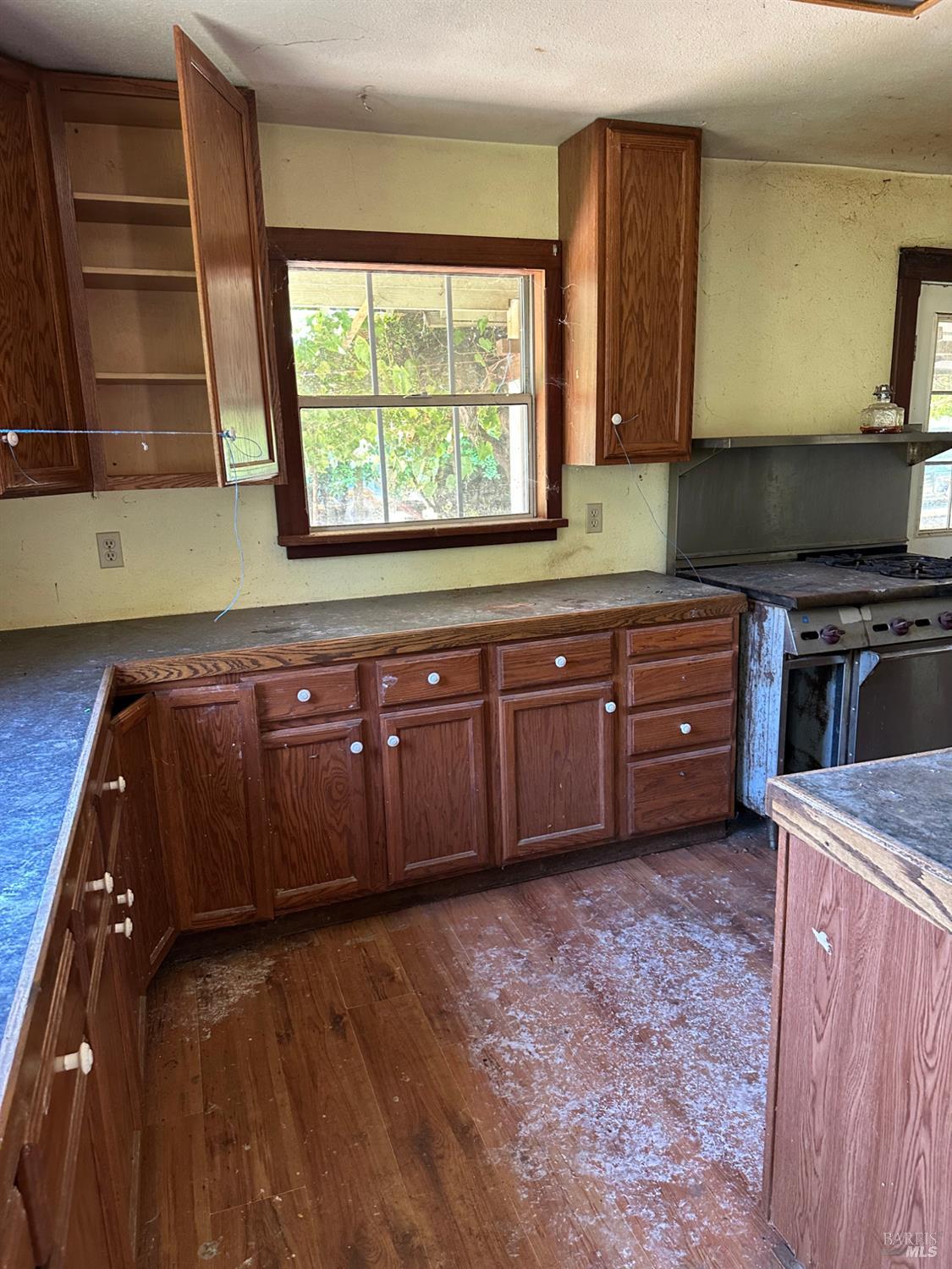 13333 Low Gap Road Ukiah, CA 95482 - Photo 30 of 50 a kitchen with stainless steel appliances granite countertop a stove a sink and a microwave
