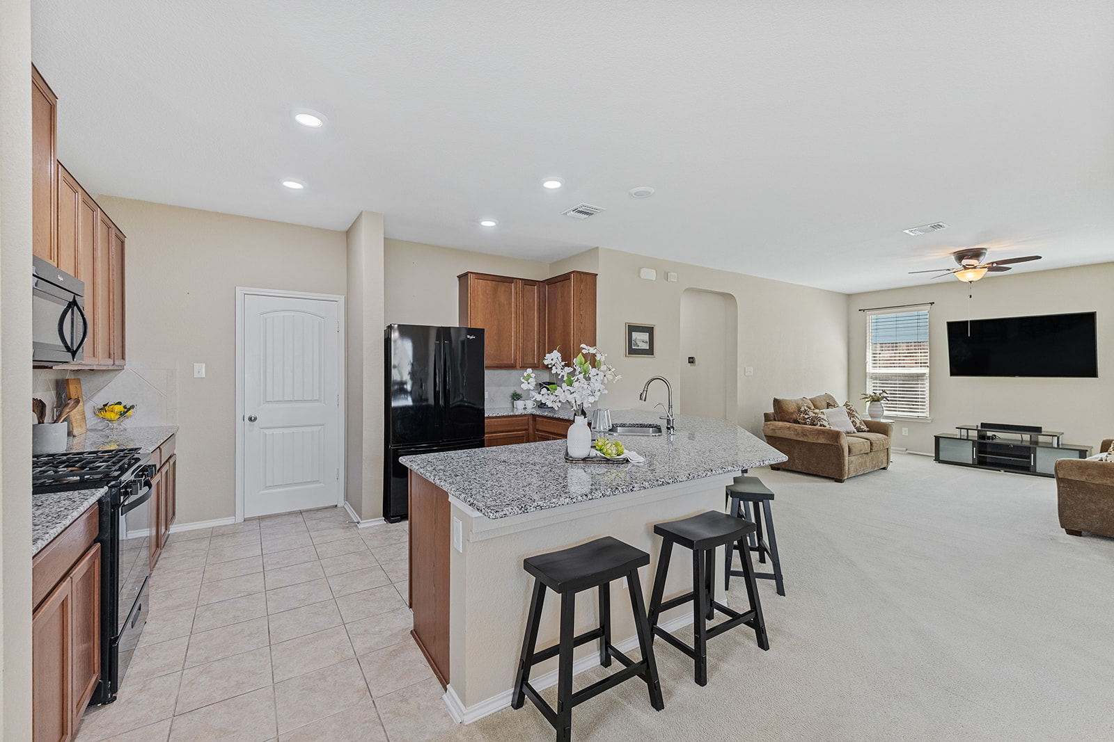 437 Sheepshank Drive Georgetown, TX 78633 - Photo 22 of 22 An open floorplan seamlessly connects the kitchen with the spacious living area bridged by the spacious central counter.