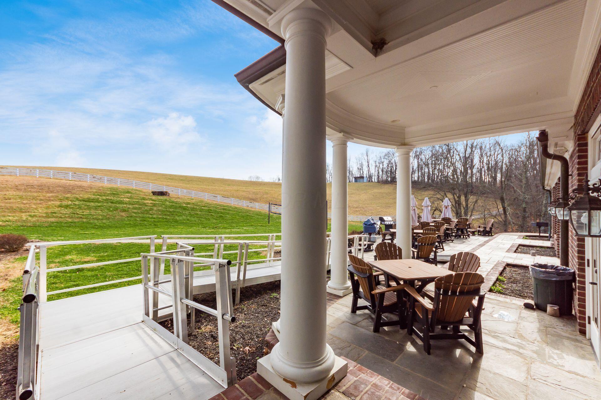 16187 Kreashbaum Road Rockbridge, OH 43149 - Photo 13 of 66 View of rear patio with ramp and vista views.