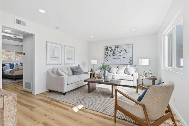 a living room with furniture and a view of living room