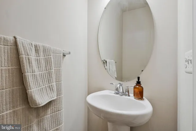 a bathroom with a sink and mirror
