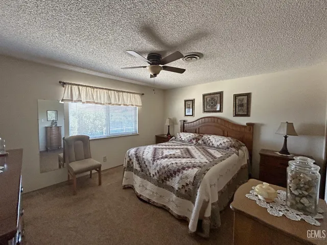 a bedroom with bed and a window