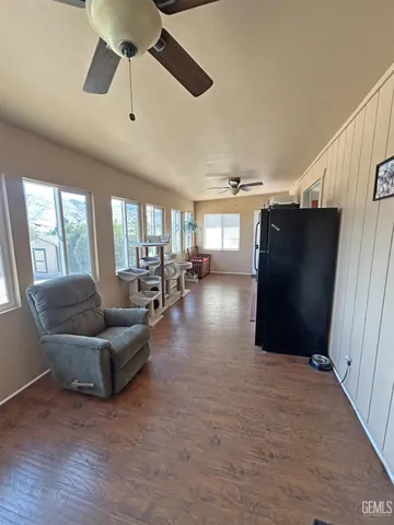 a living room with lots of furniture and a chandelier
