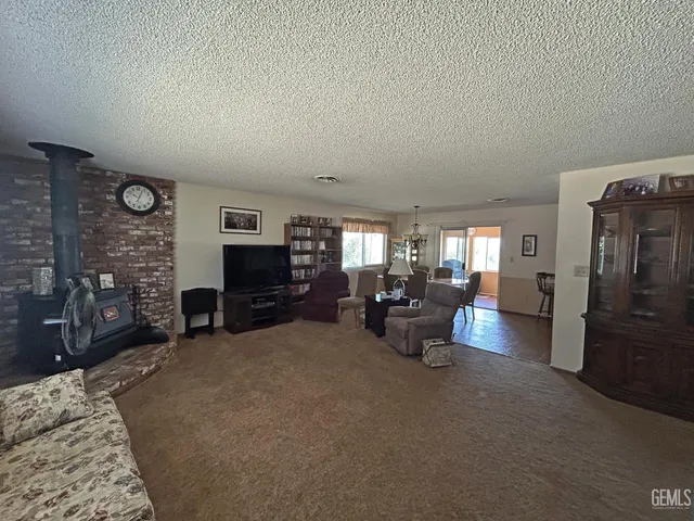 a view of a livingroom with furniture and window