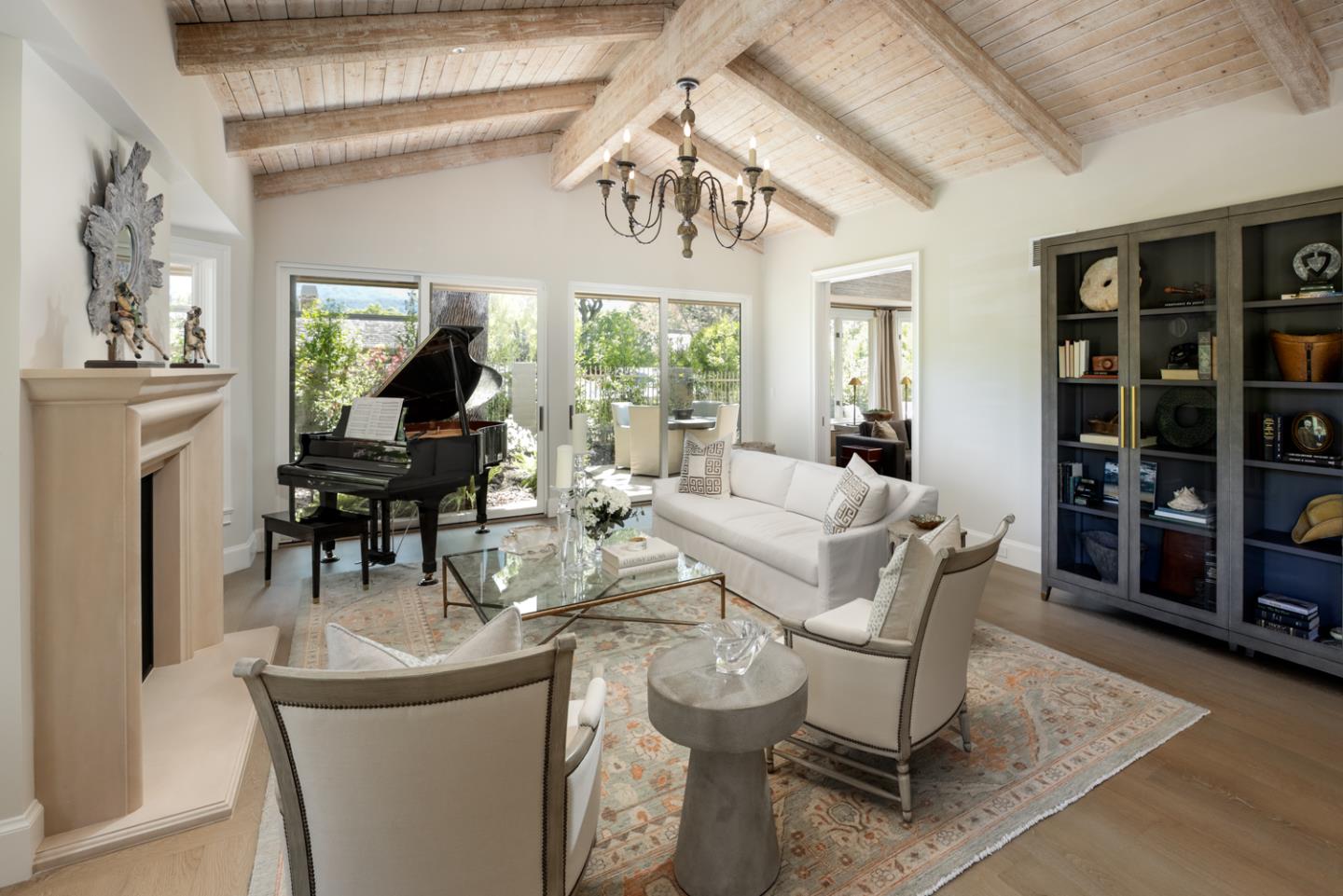 620 Morningside Circle Los Altos, CA 94022 - Photo 12 of 32 a living room with furniture a chandelier and a dining table with wooden floor