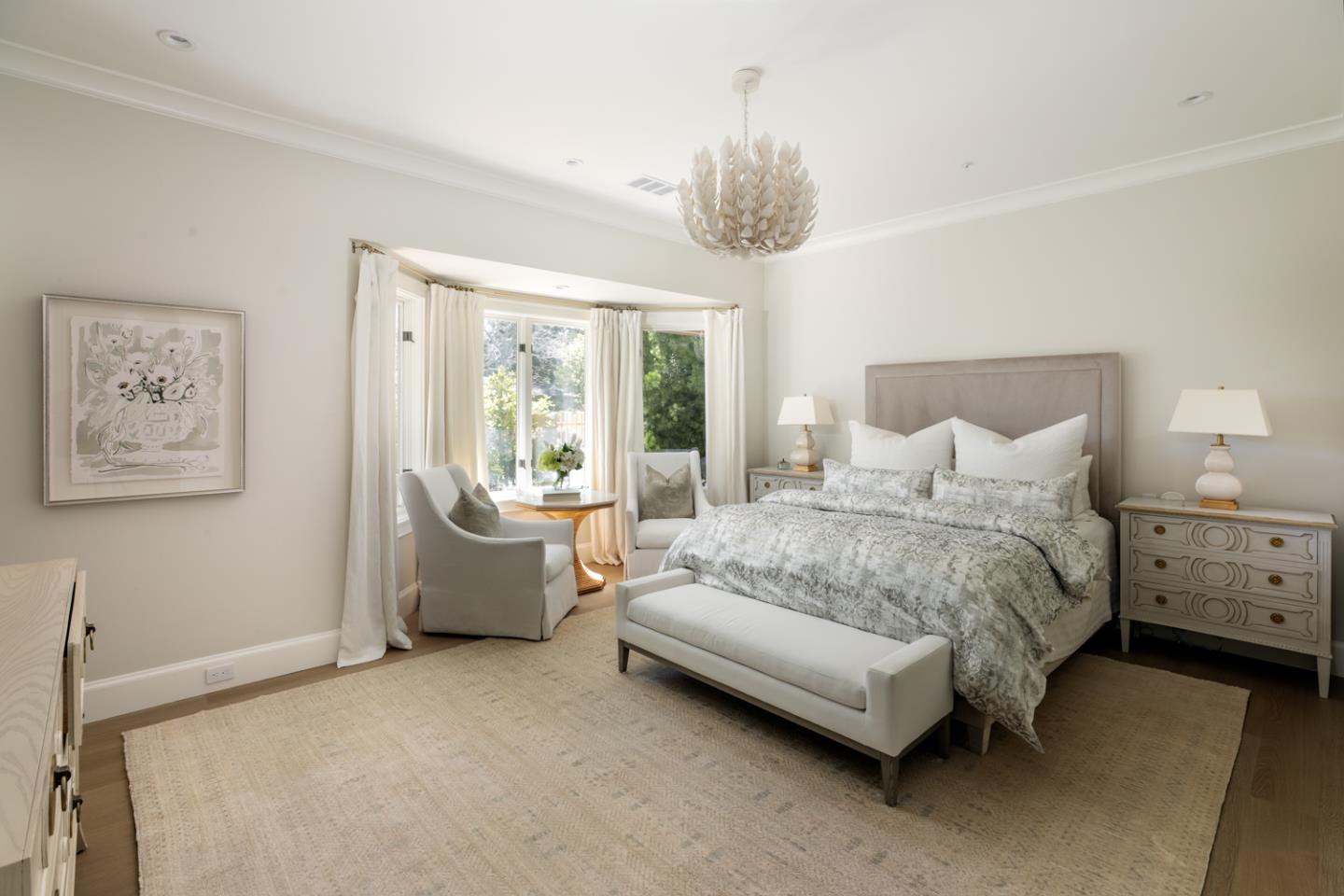 620 Morningside Circle Los Altos, CA 94022 - Photo 19 of 32 a spacious bedroom with a bed and a chandelier