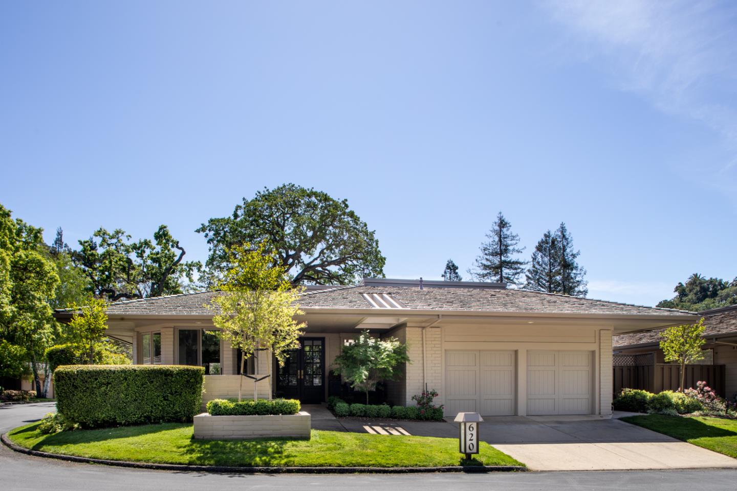 620 Morningside Circle Los Altos, CA 94022 - Photo 2 of 32 a front view of a house with a yard garage and outdoor seating
