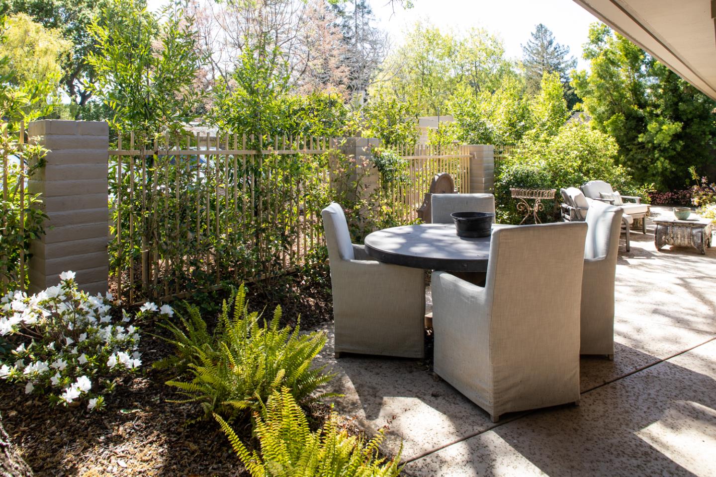 620 Morningside Circle Los Altos, CA 94022 - Photo 26 of 32 a view of a patio with table and chairs and a flower pot