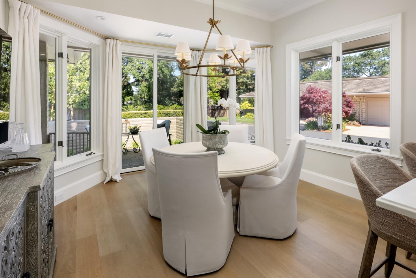 620 Morningside Circle Los Altos, CA 94022 - Photo 5 of 32 a dining room with furniture a chandelier and wooden floor