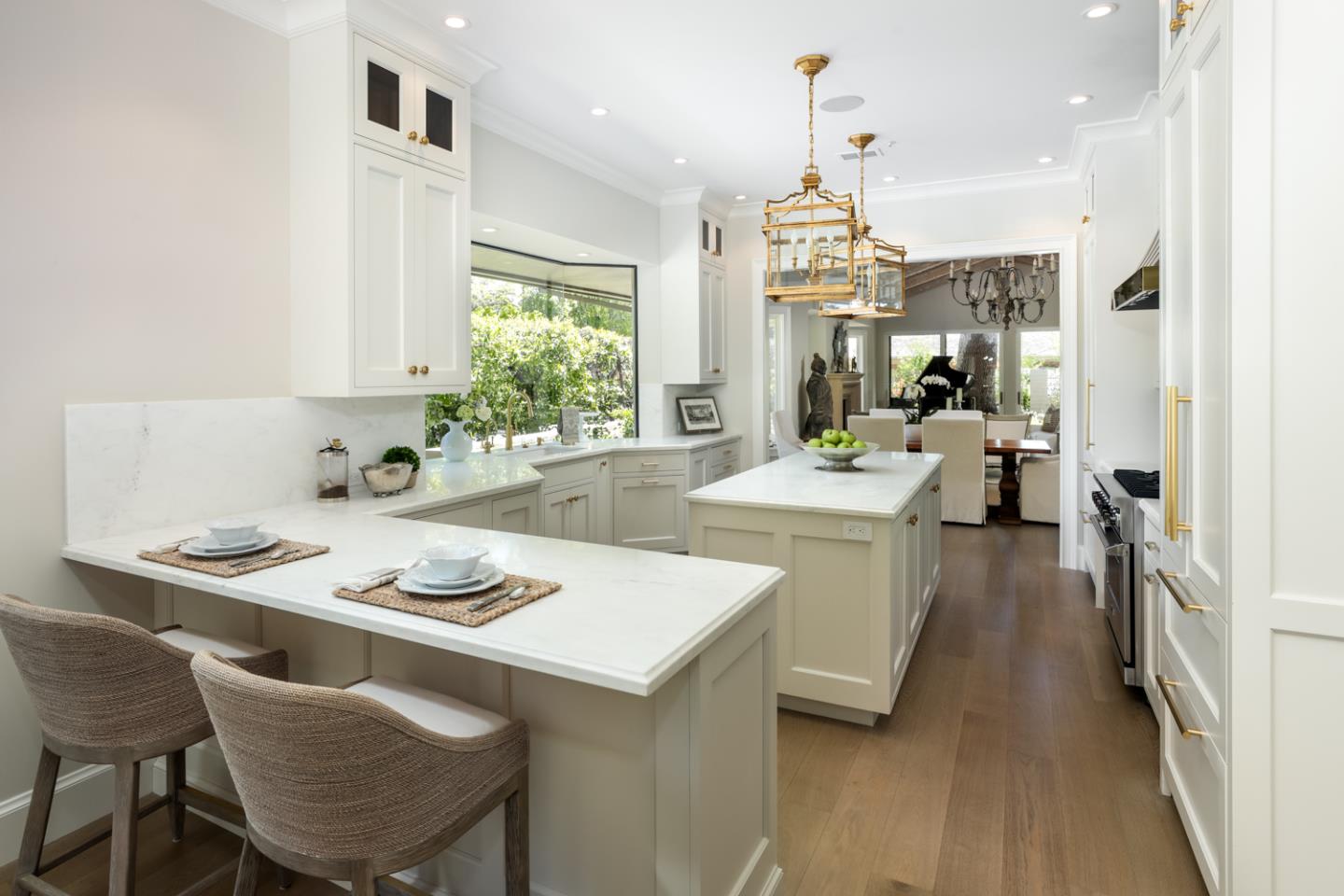620 Morningside Circle Los Altos, CA 94022 - Photo 7 of 32 a kitchen with a dining table chairs and white cabinets