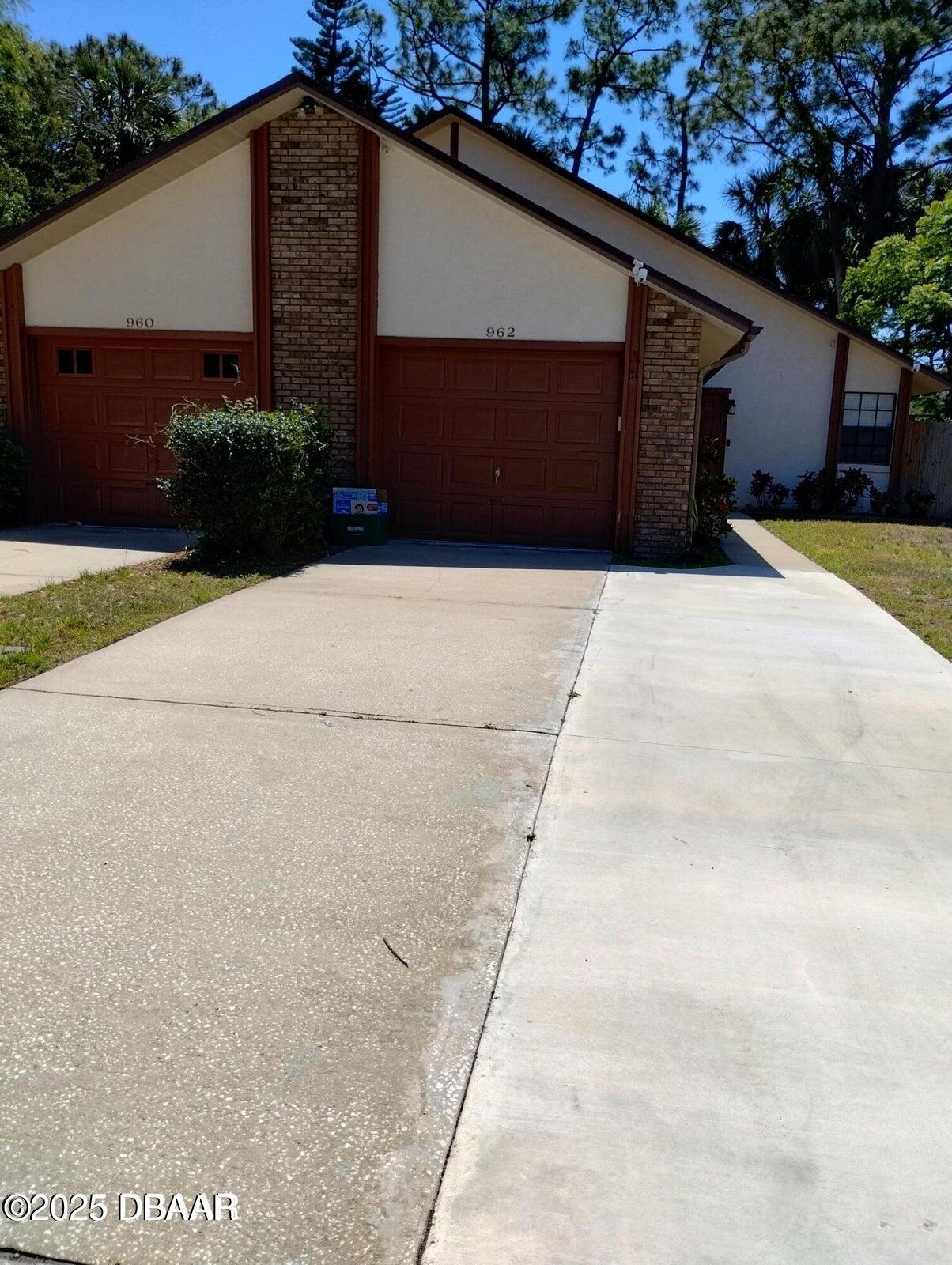 962 Stonybrook Circle Port Orange, FL 32127 - Photo 15 of 15 a house with a yard